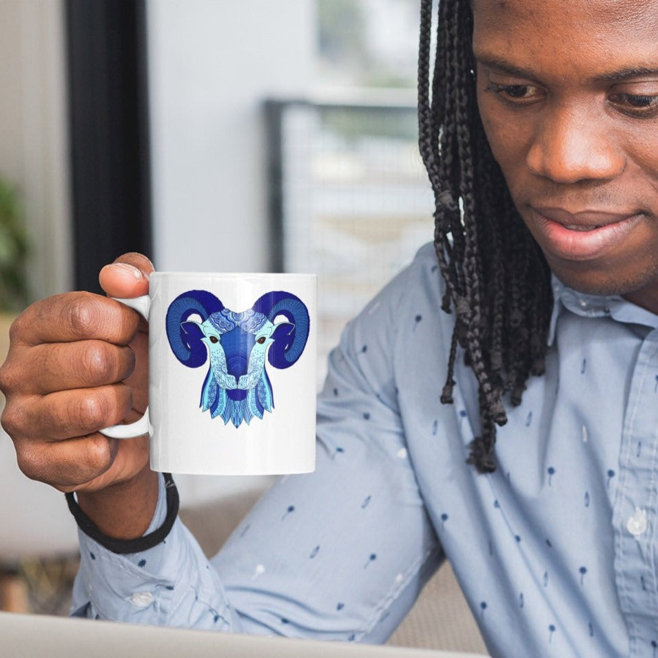 Image of Model holding Coffee Mug with Aries Sign designed by AK Pattern Studio